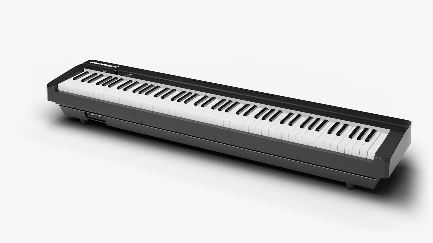Piano Legend vu de trois quarts, finition noire satinée, sur fond clair.